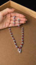 Heart pendant necklace with red stones